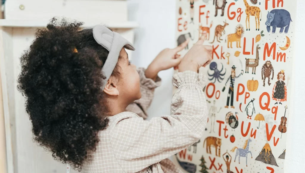 child using a letterboard