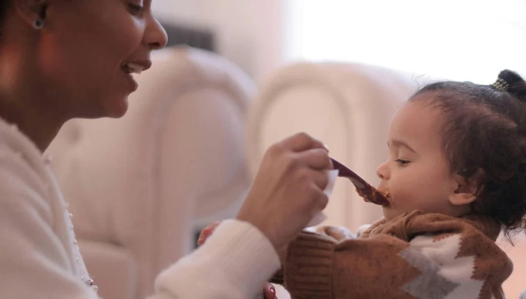 mother feeding baby